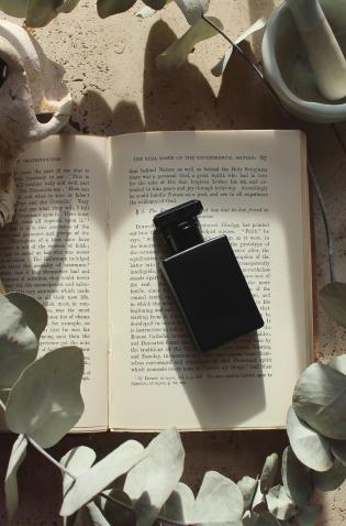 Dried orange petals in a decorative black bowl.