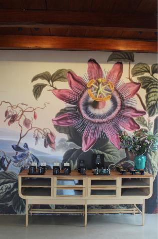 A view of the Grace Atelier shop interior with a floral mural.
